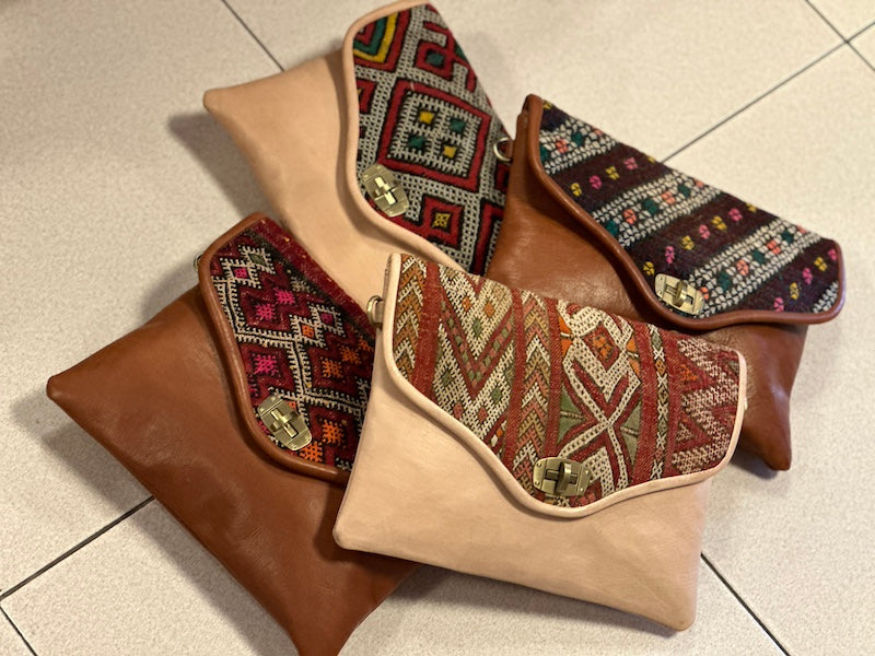 leather clutch with embroidery details